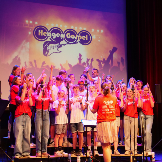 A group of people on stage

Description automatically generated