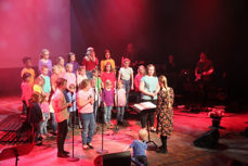 Halden barne- og ungdomskor under ledelse av Marie Håkensen. Bilde fra jubileumskonsert i Brygga kultursal.